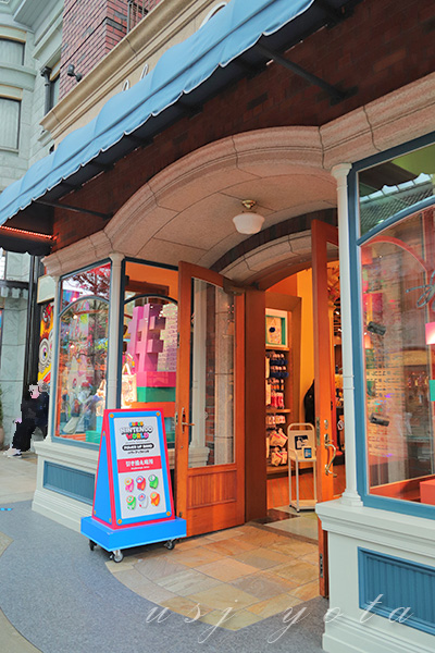 パワーアップバンド引き換え所の看板